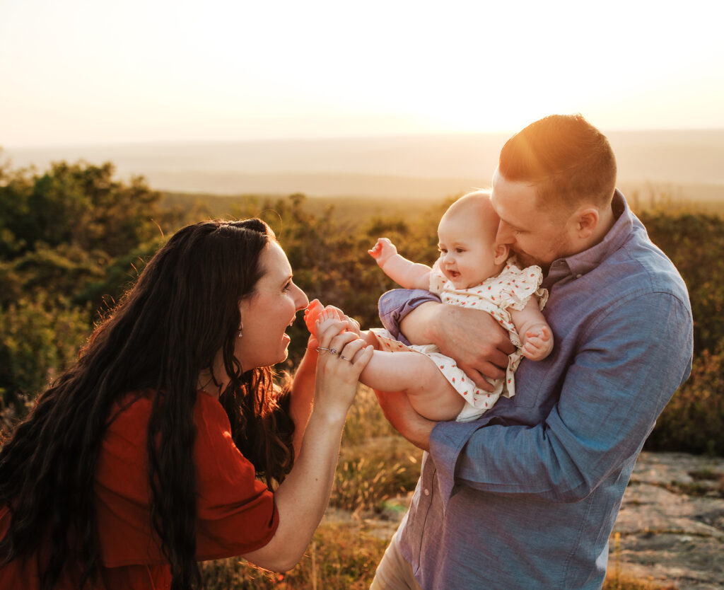Morris county family photographer photographing a family during sunset.