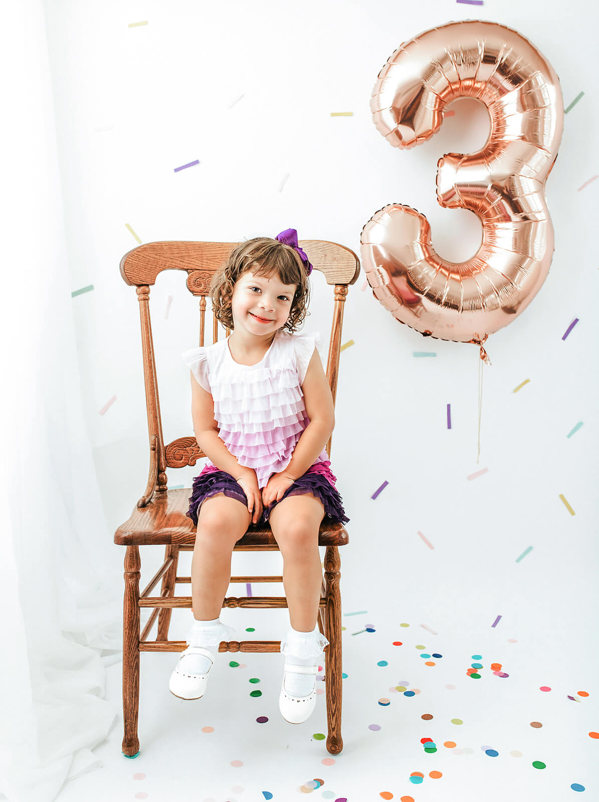Toddler girl celebrating her birthday at a photo studio near Morristown NJ