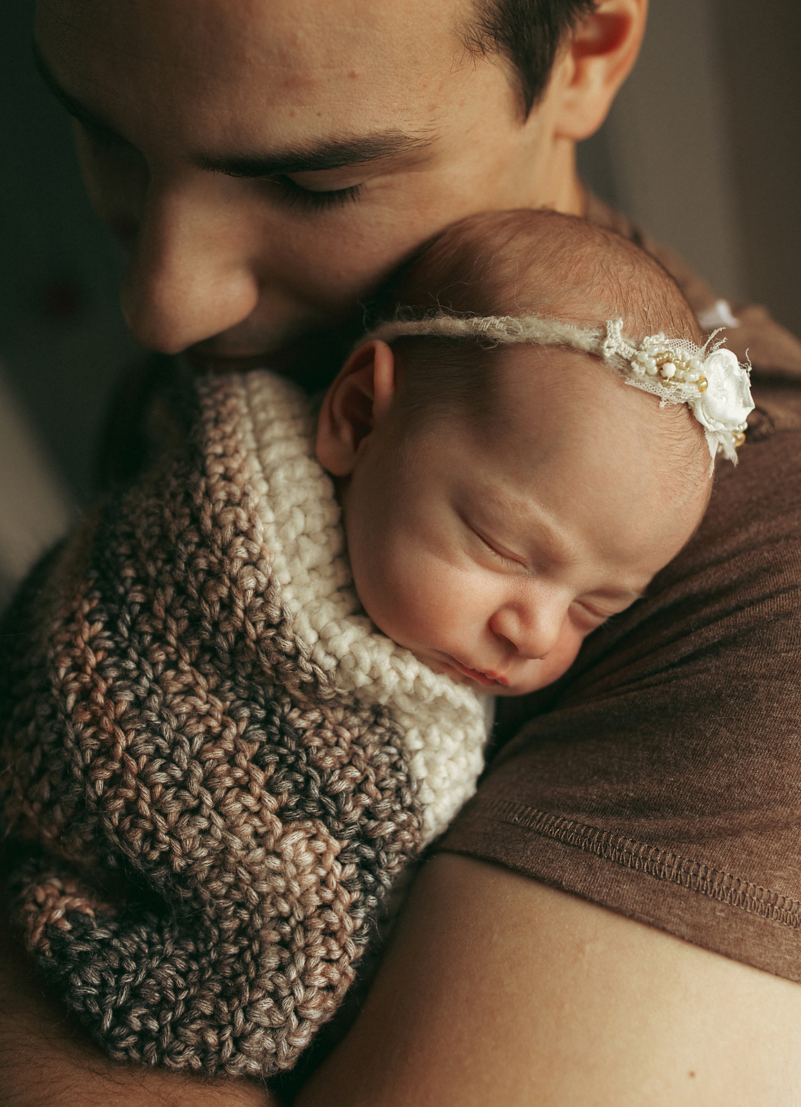 Dad hugging his newborn daughter in Morristown NJ