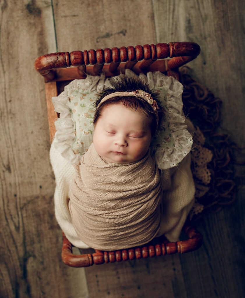 Newborn girl swaddled photographed in her home in Morristown NJ