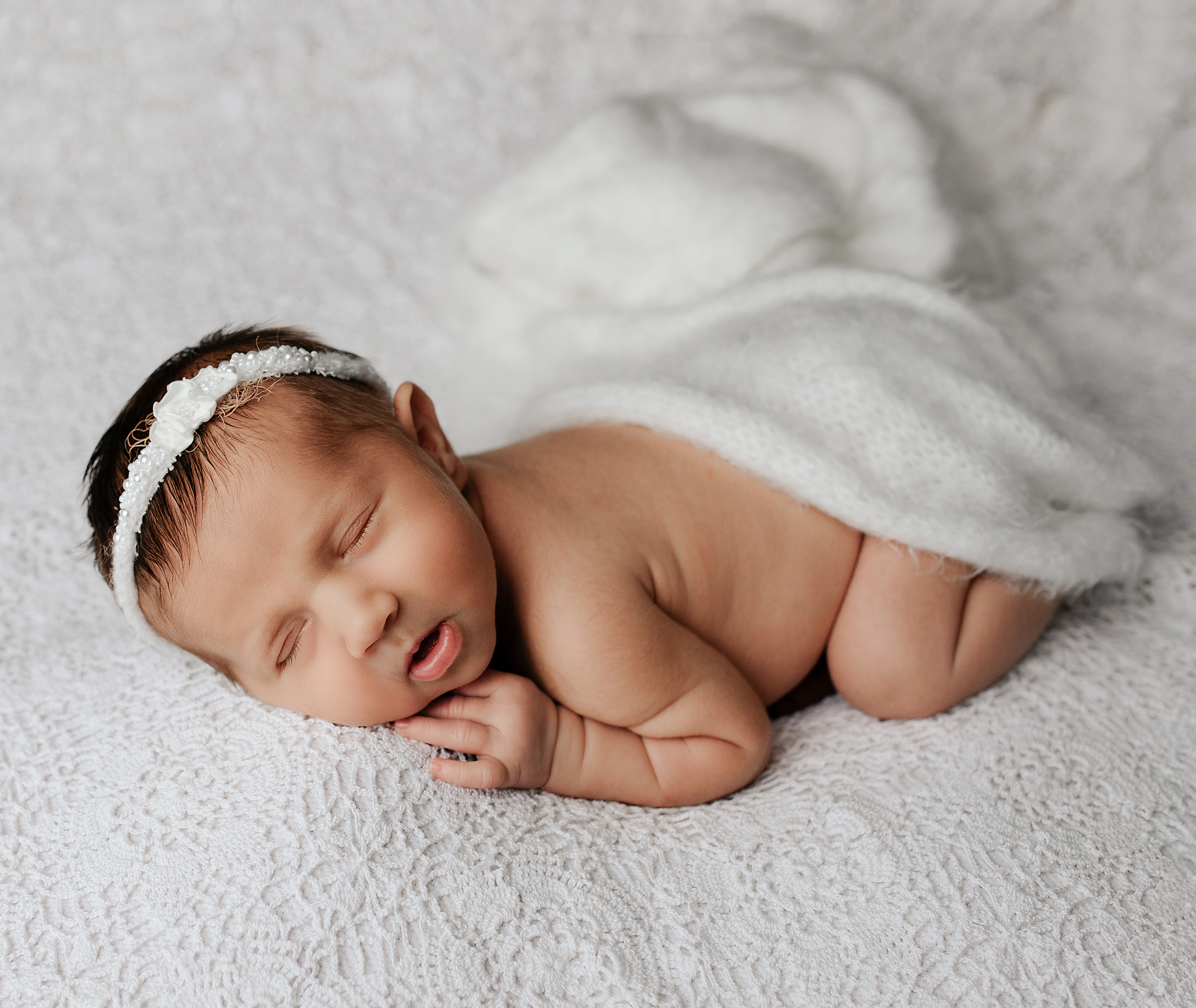 newborn baby sleeping on a white blanket in Morristown home, NJ